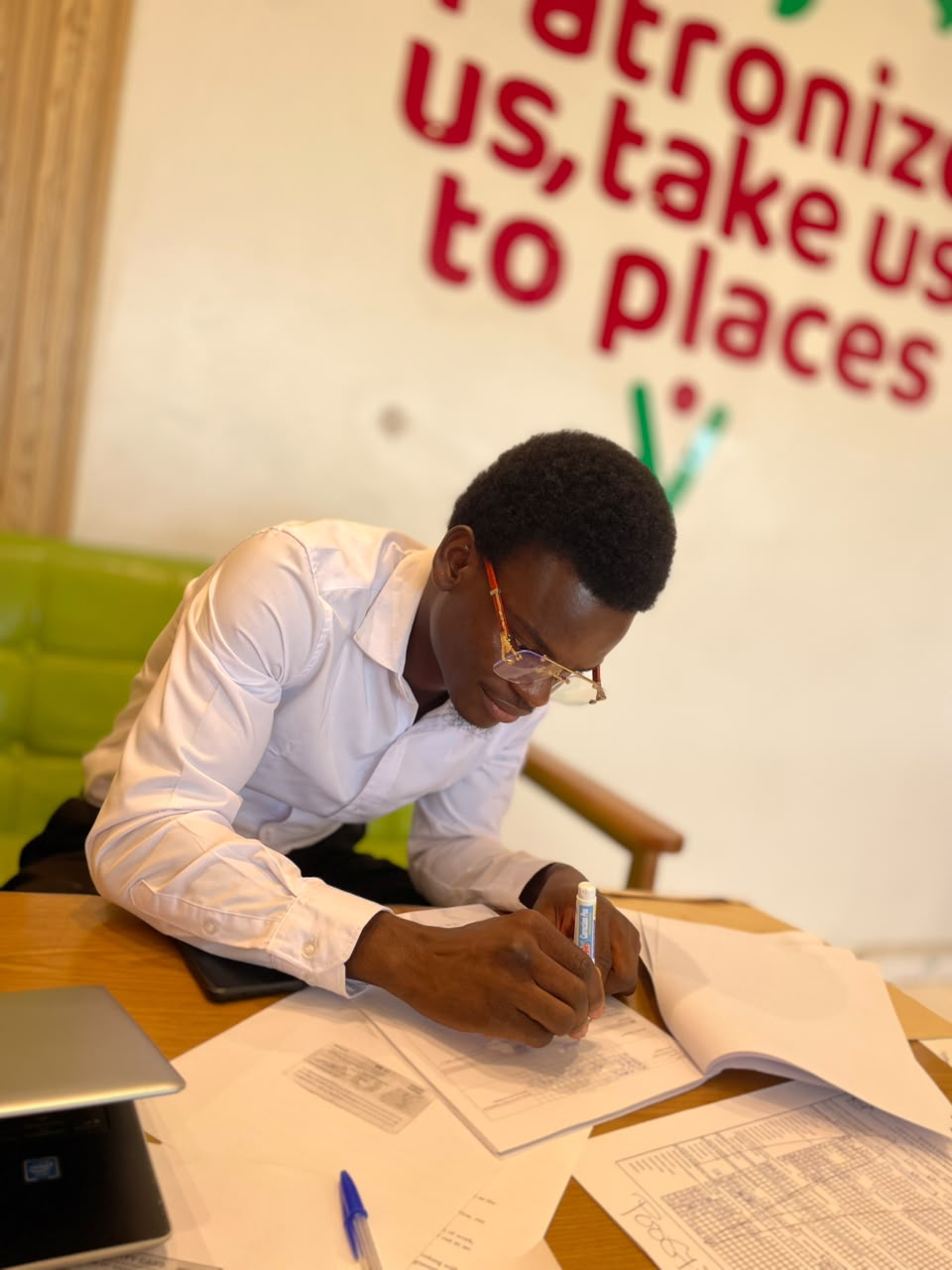 Charles Anaba working on business plans